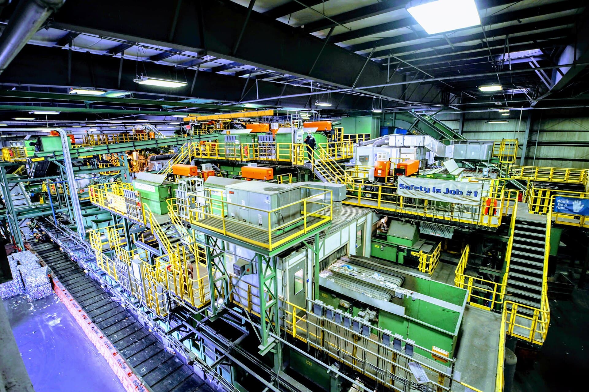 Conveyors, sorting decks and gantries inside a materials recovery facility